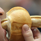 Man eating extremely long bratwurst